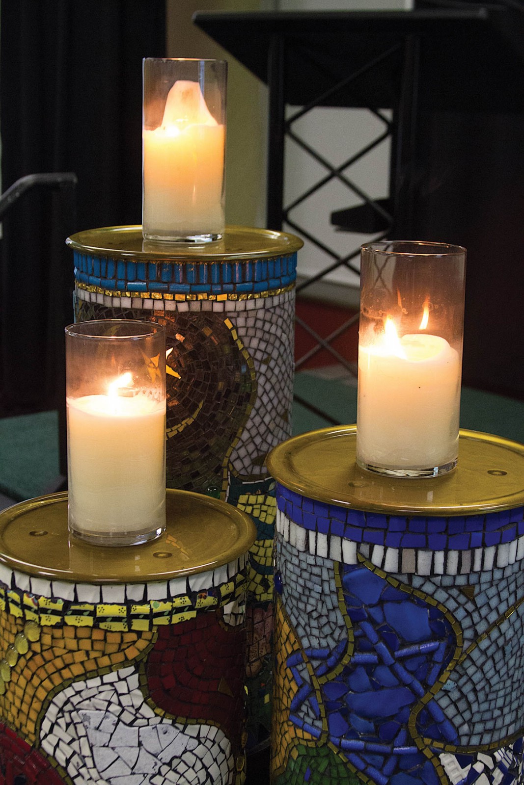 lit candles on pedestals
