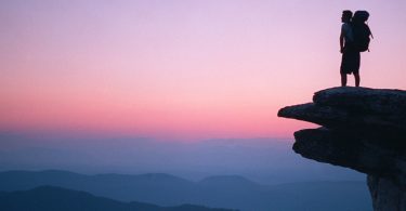Hiker taking in the view at McAfee Knob