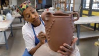 Amanda Swimmer creates a pot at Cherokee Heritage Festival in Hayesville