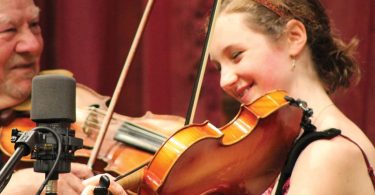 Lillian Chase twin ddling with Bobby Hicks on the Song of the Mountains stage