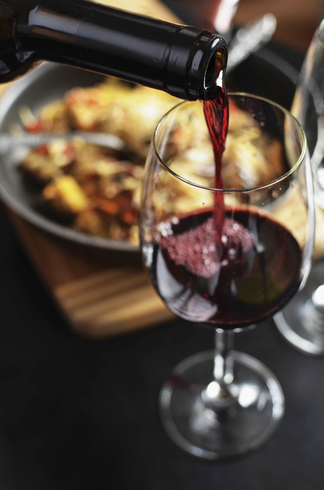 a glass of wine being poured